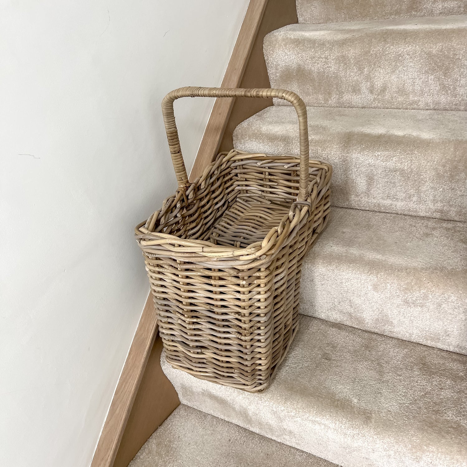 grey washed basket on stairs