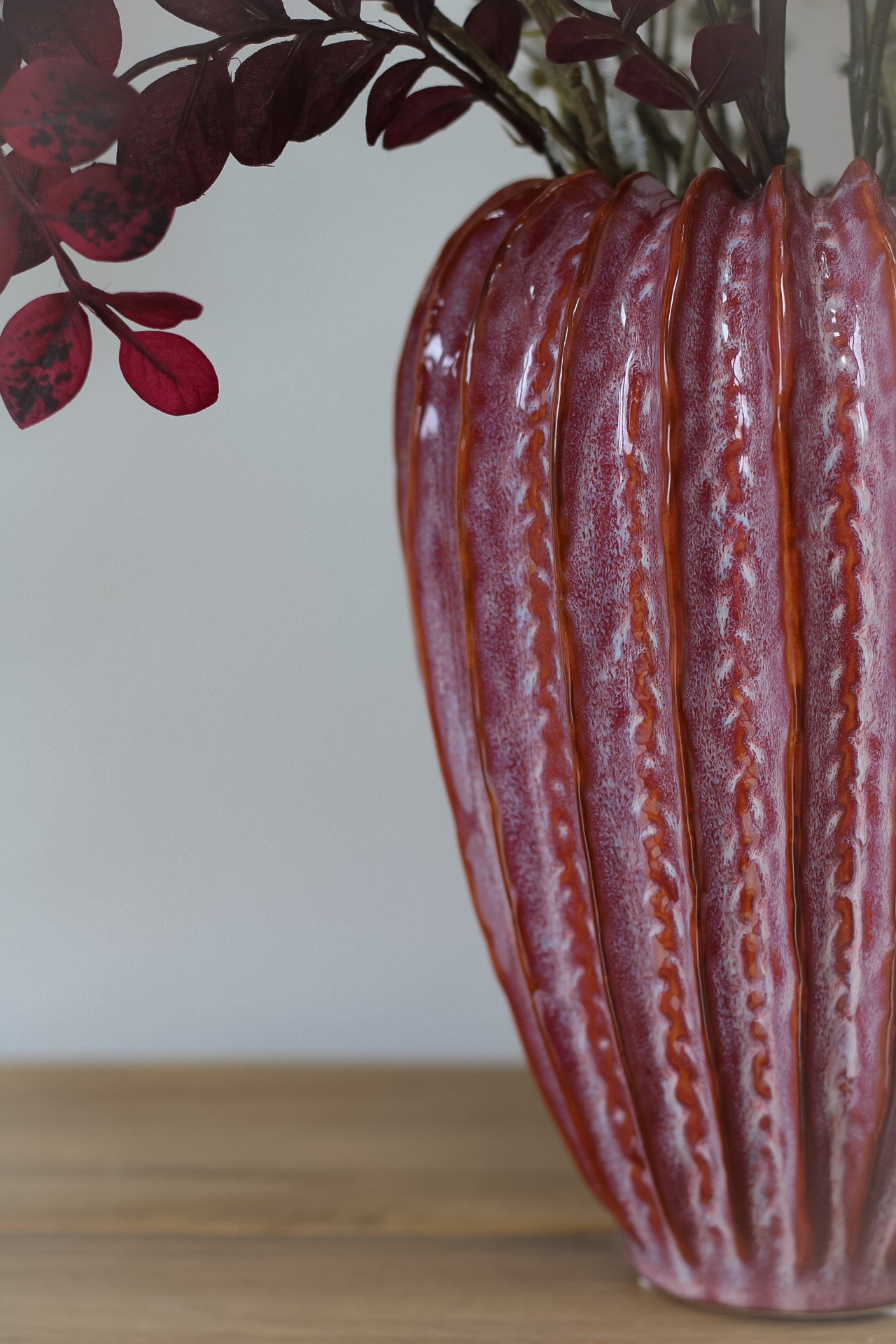 up close of raspberry ribbed vase