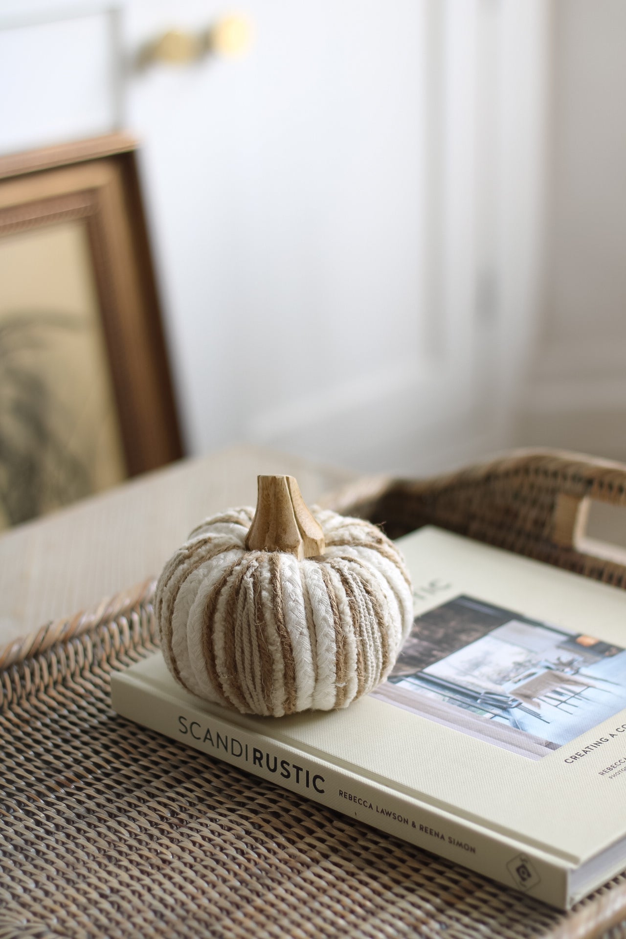 neutral fabric pumpkin with wooden stalk