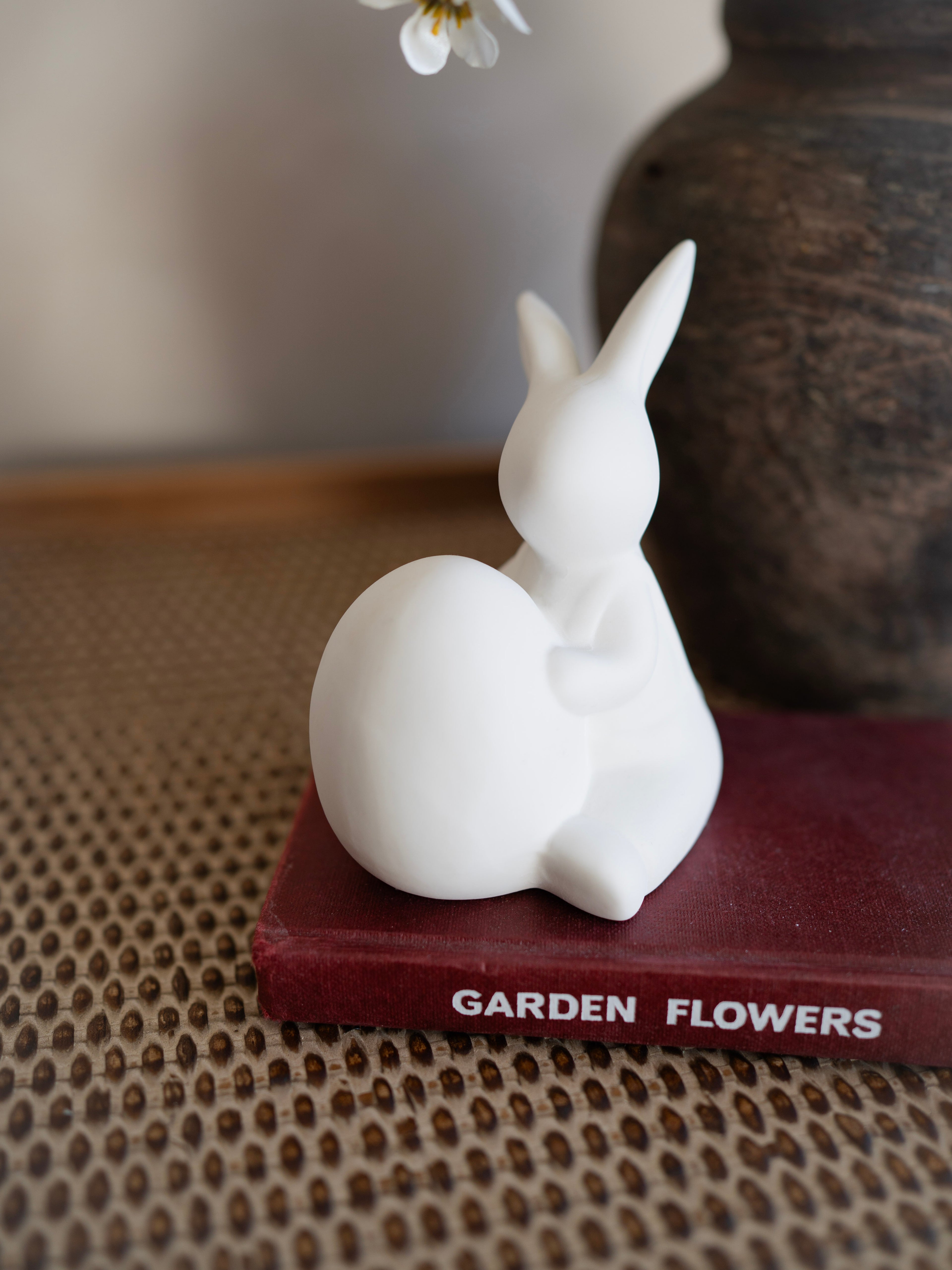 White rabbit figurine on a book titled &
