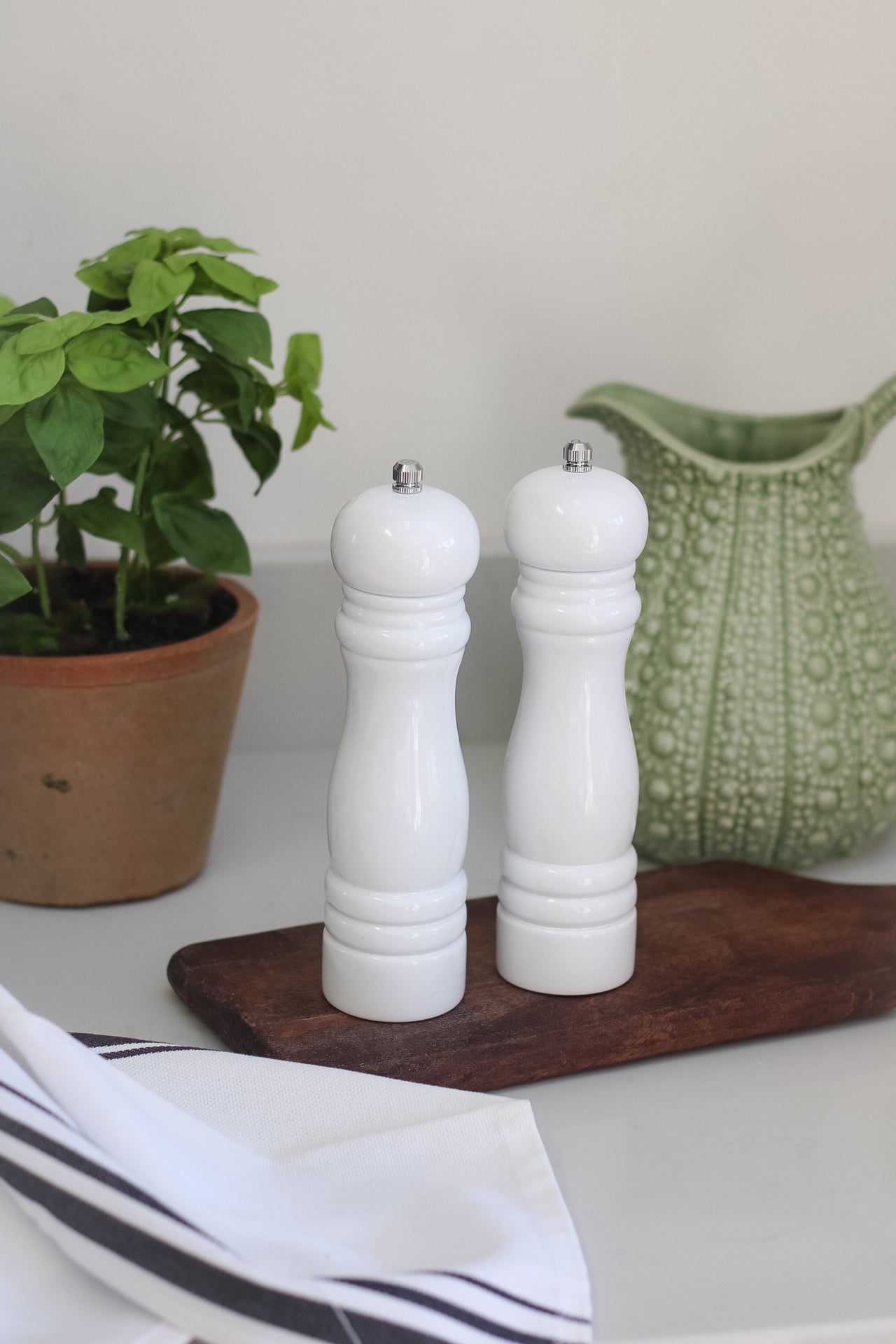 white salt and pepper grinders for timeless kitchen decor