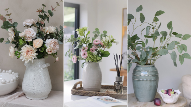 Beautiful collection of faux flowers and foliage in ceramic vases