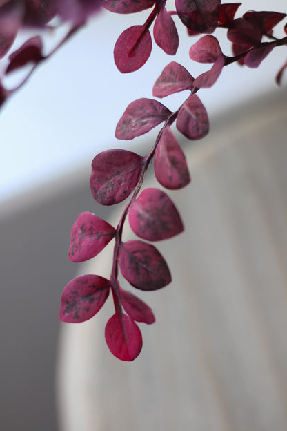 Up close of Faux Plum Mini Leaves Spray