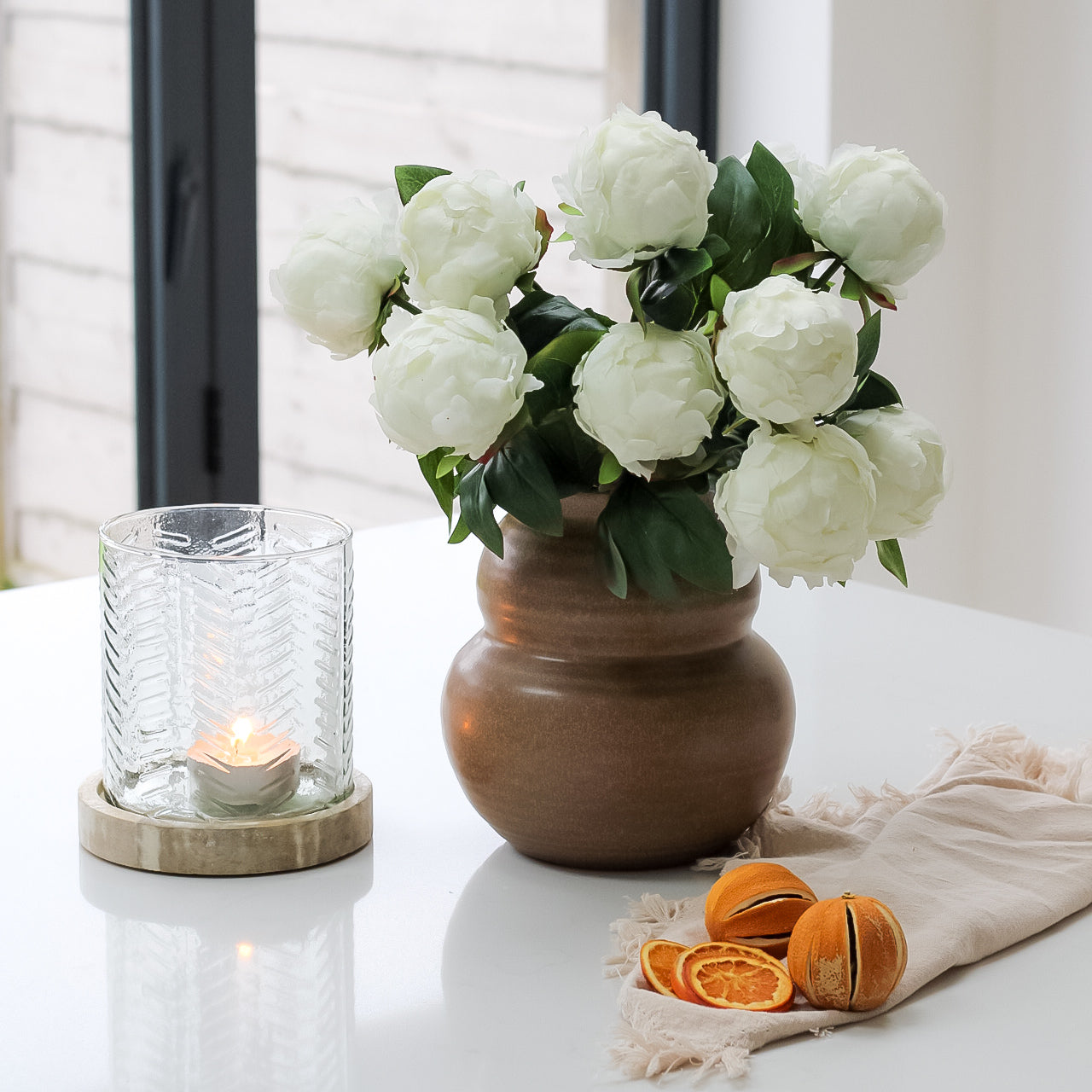elegant brown vase with faux white peonies