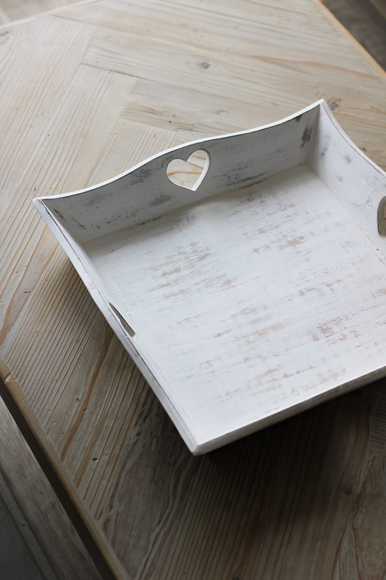 white wooden tray with heart cut outs
