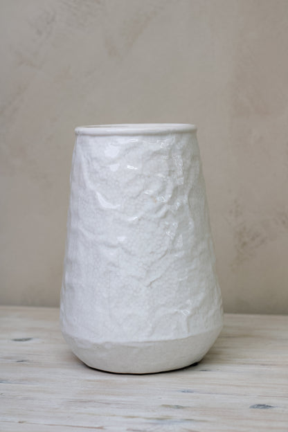 white textured vase for faux flowers