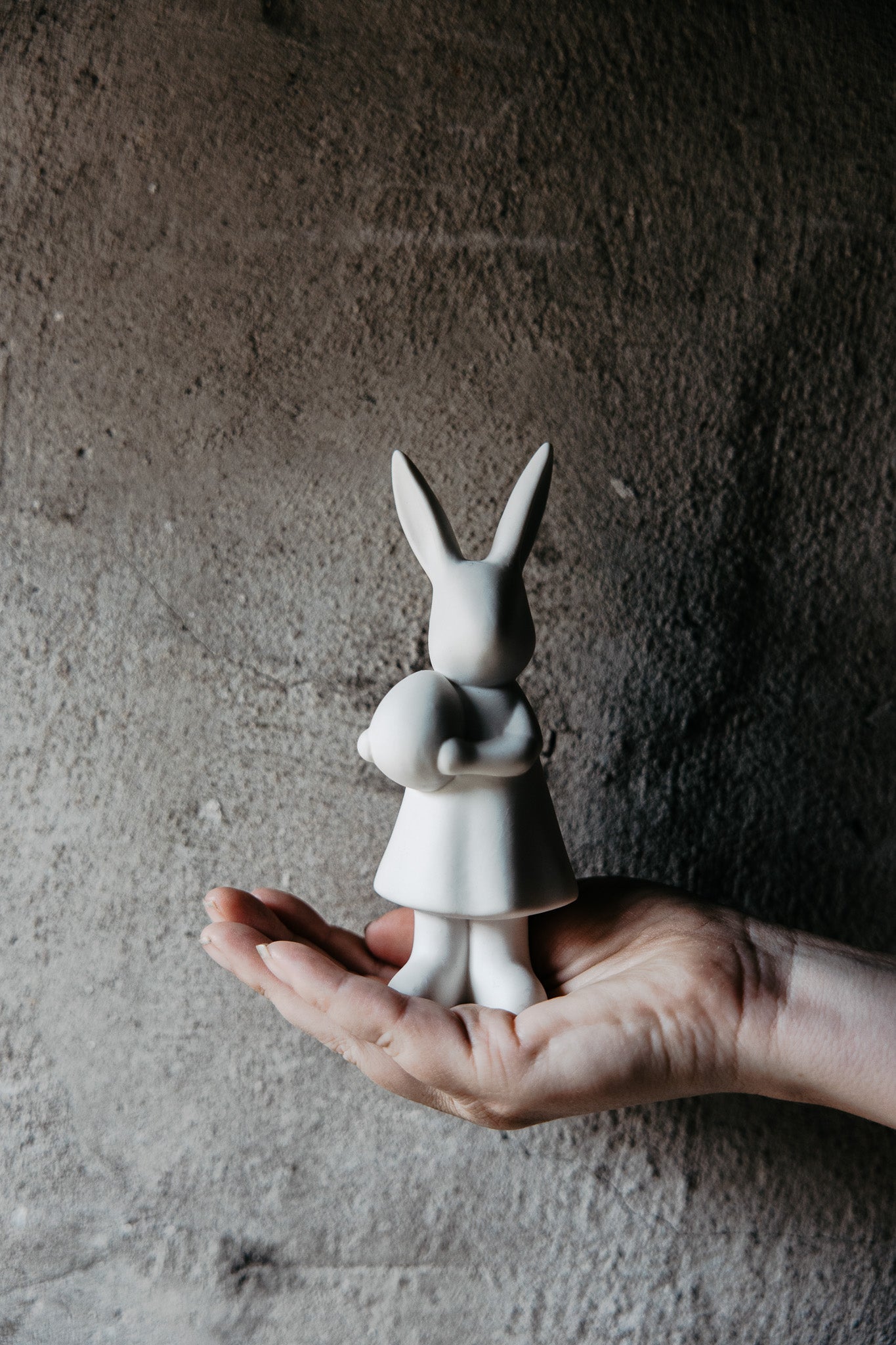 Adorable white spring bunny with easter egg