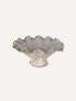 A ruffled ceramic bowl with a textured, leaf-like pattern in gray and cream, featuring a subtle copper-brown glaze along the rim, set against a solid off-white background.