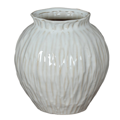 White ceramic vase with ribbed texture on a white background