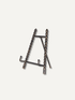 A dark bronze  beaded mini easel with a beaded chain design, shown on a plain off-white background.