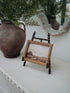 Antique Gold Beaded Mini Easel with vintage style landscape artwork and terracotta amphora style vase with faux ferns in the background
