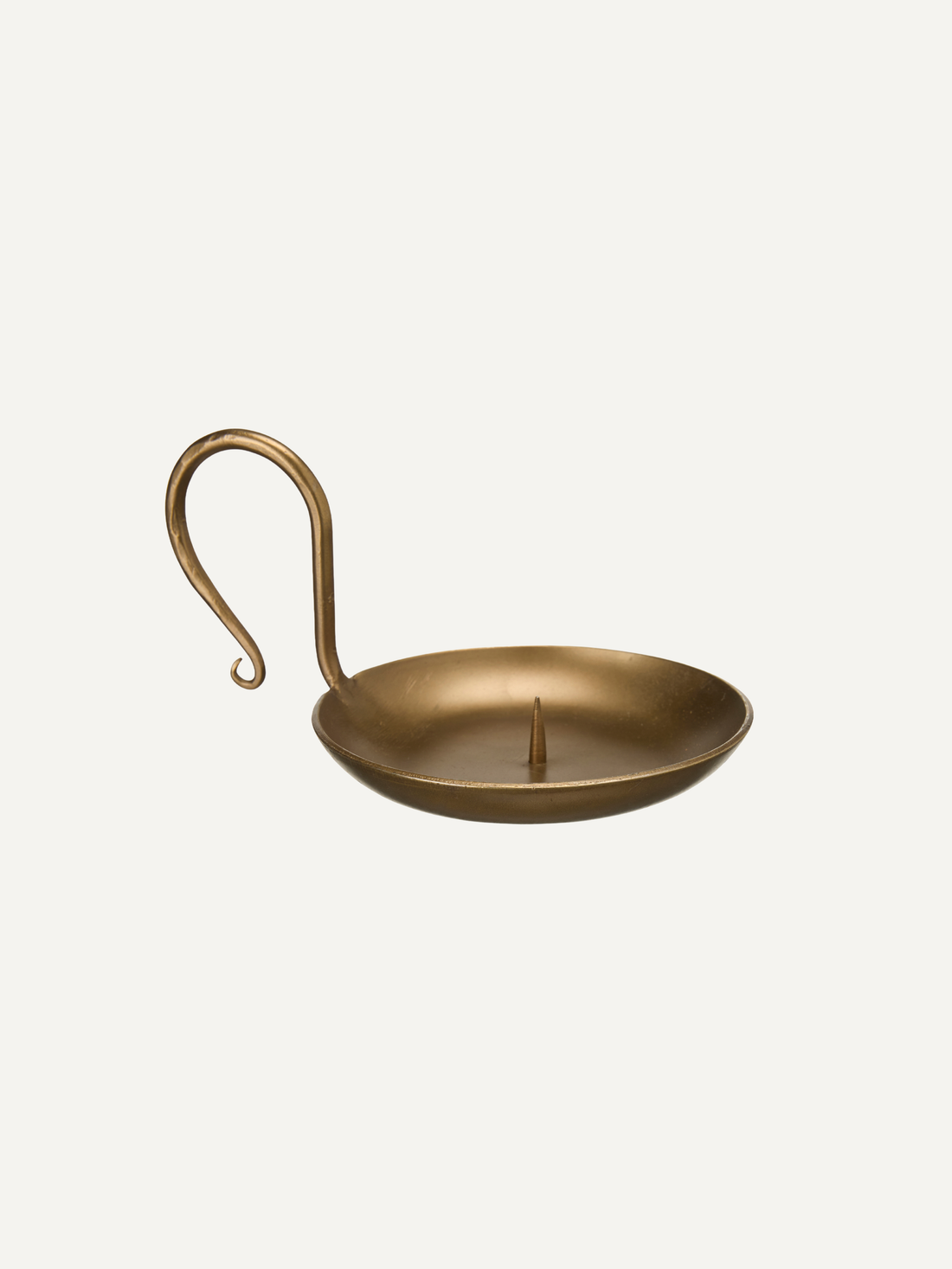Gold candle holder with a hook on a light beige background, home styling for modern country and vintage style deocorating