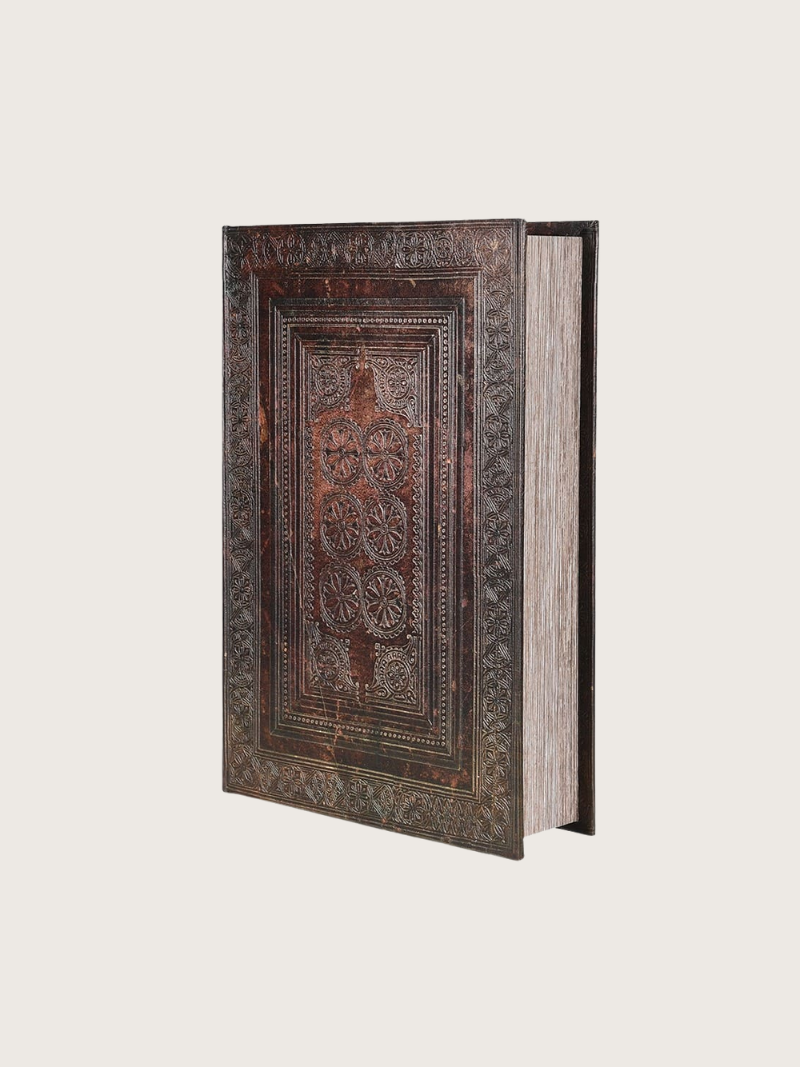 Decorative book with intricate patterns on a white background