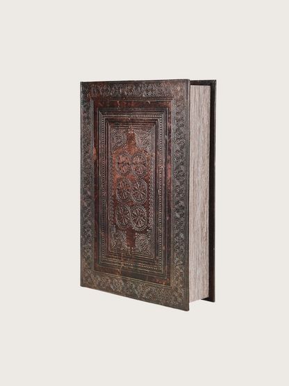 Decorative book with intricate patterns on a white background