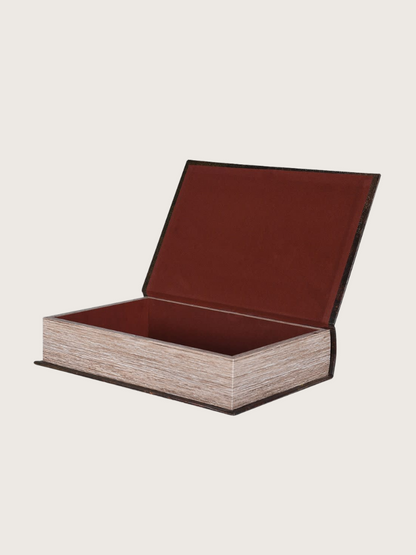 Wooden box with a brown leather lid on a beige background