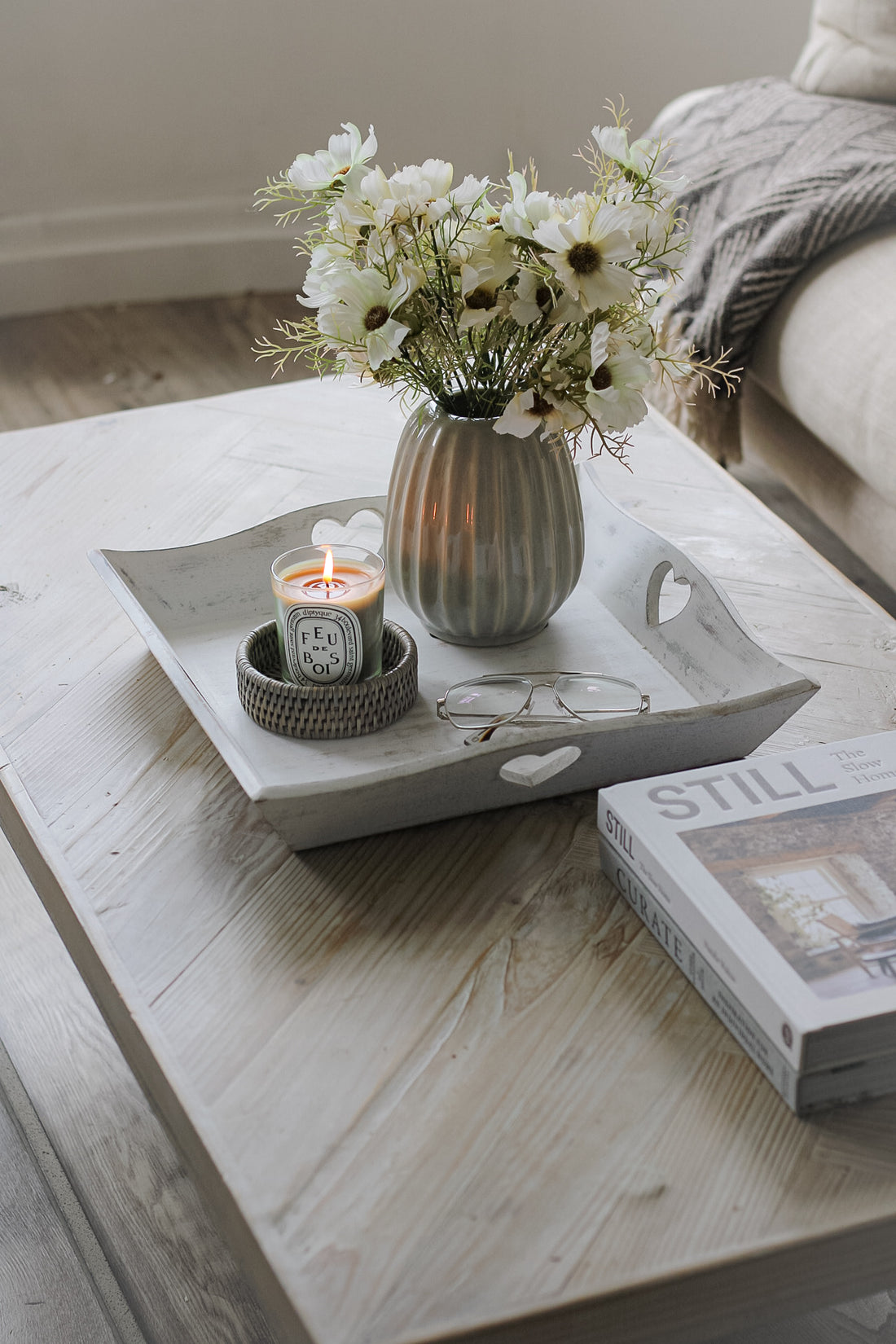 white washed wooden tray on coffee table