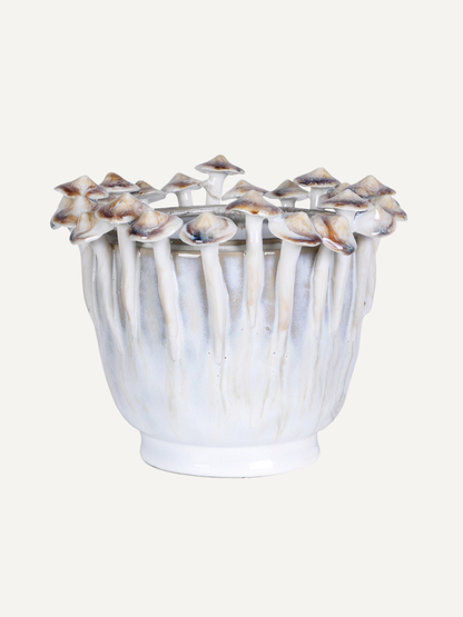 Decorative vase with mushroom-shaped top on a white background
