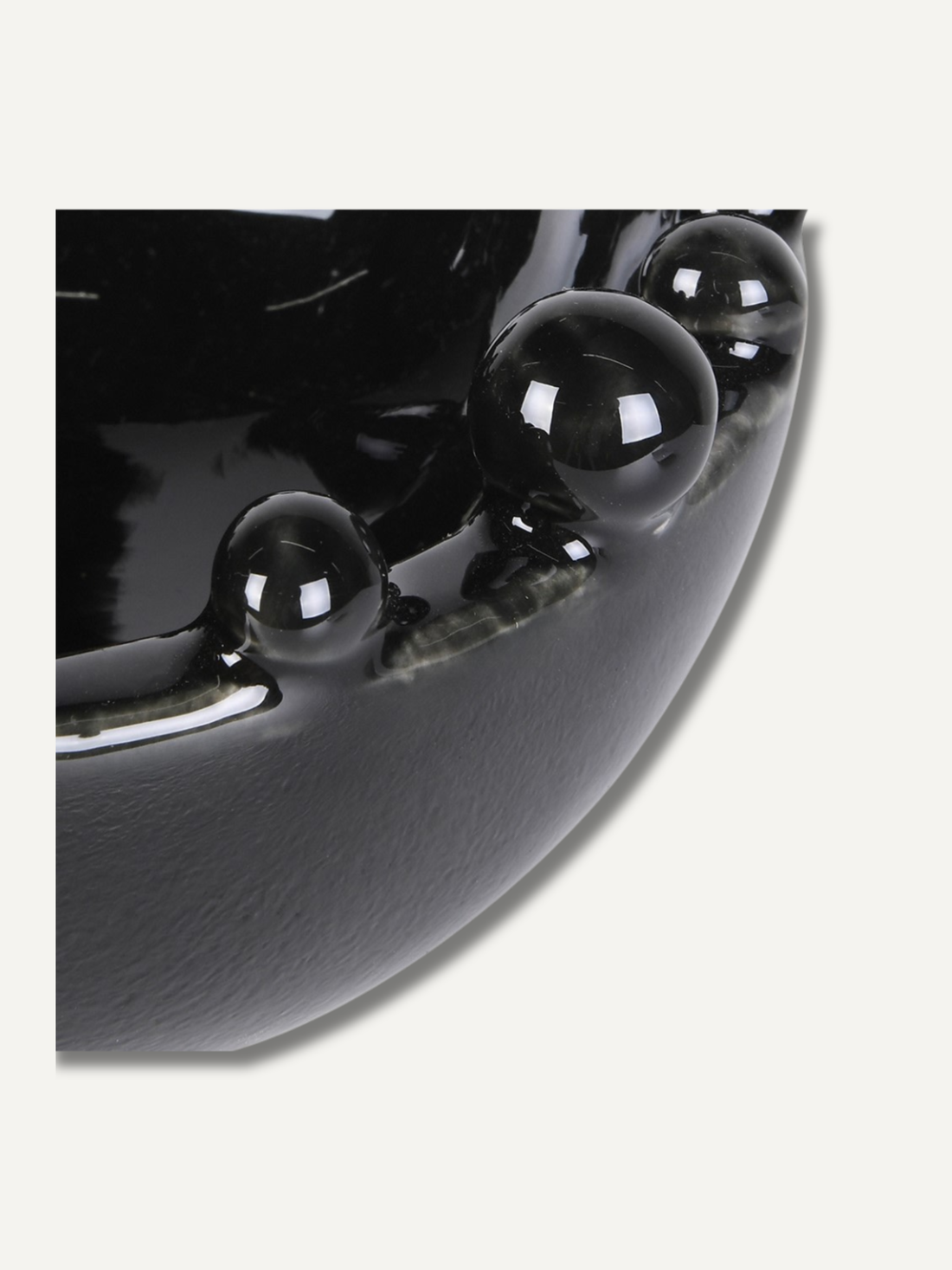 Close-up of a black ceramic bowl with glossy finish
