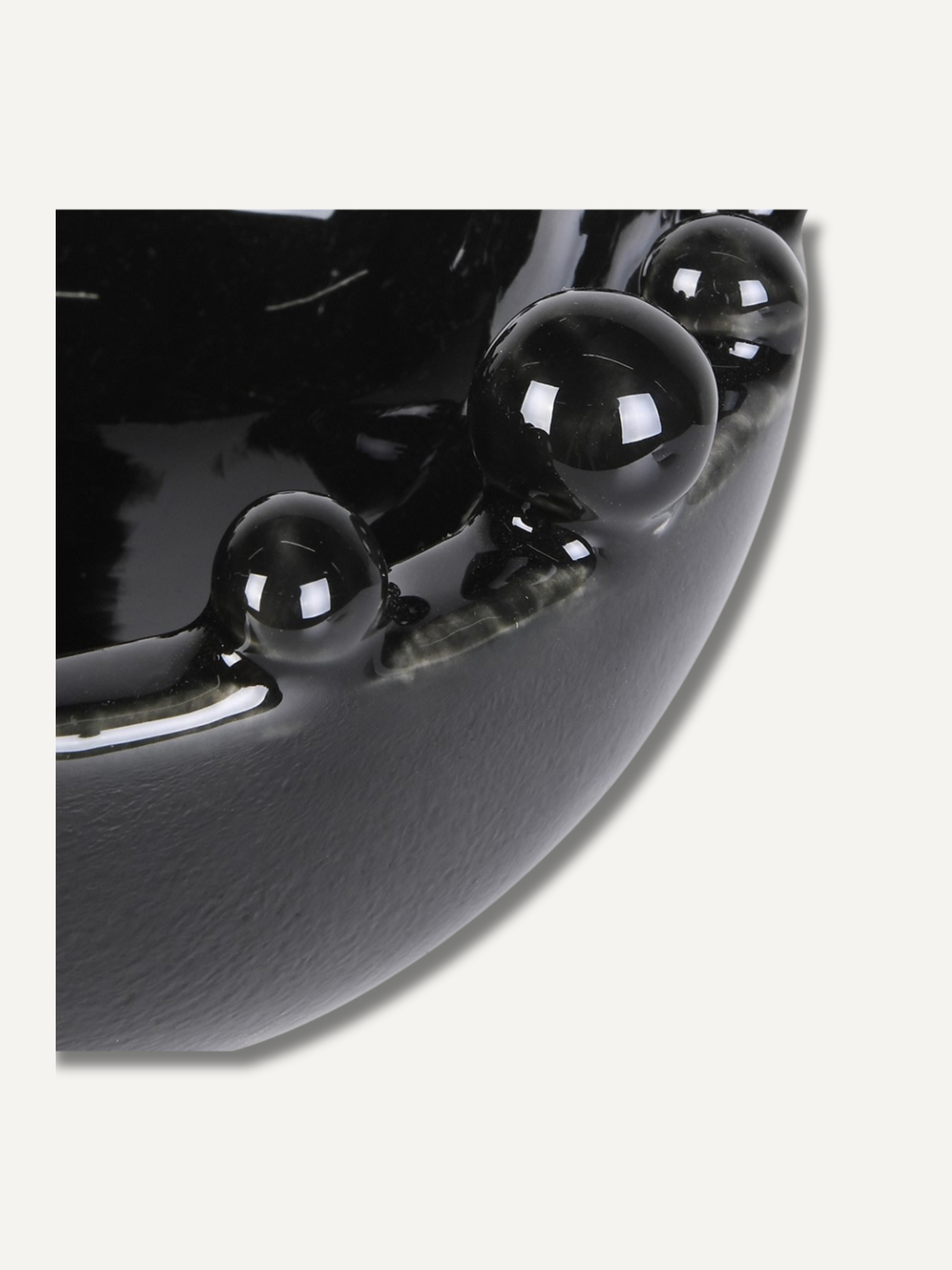 Close-up of a black ceramic bowl with glossy finish
