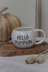 white pumpkin shaped mug with black hello pumpkin text