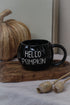 black pumpkin shaped mug with white hello pumpkin text
