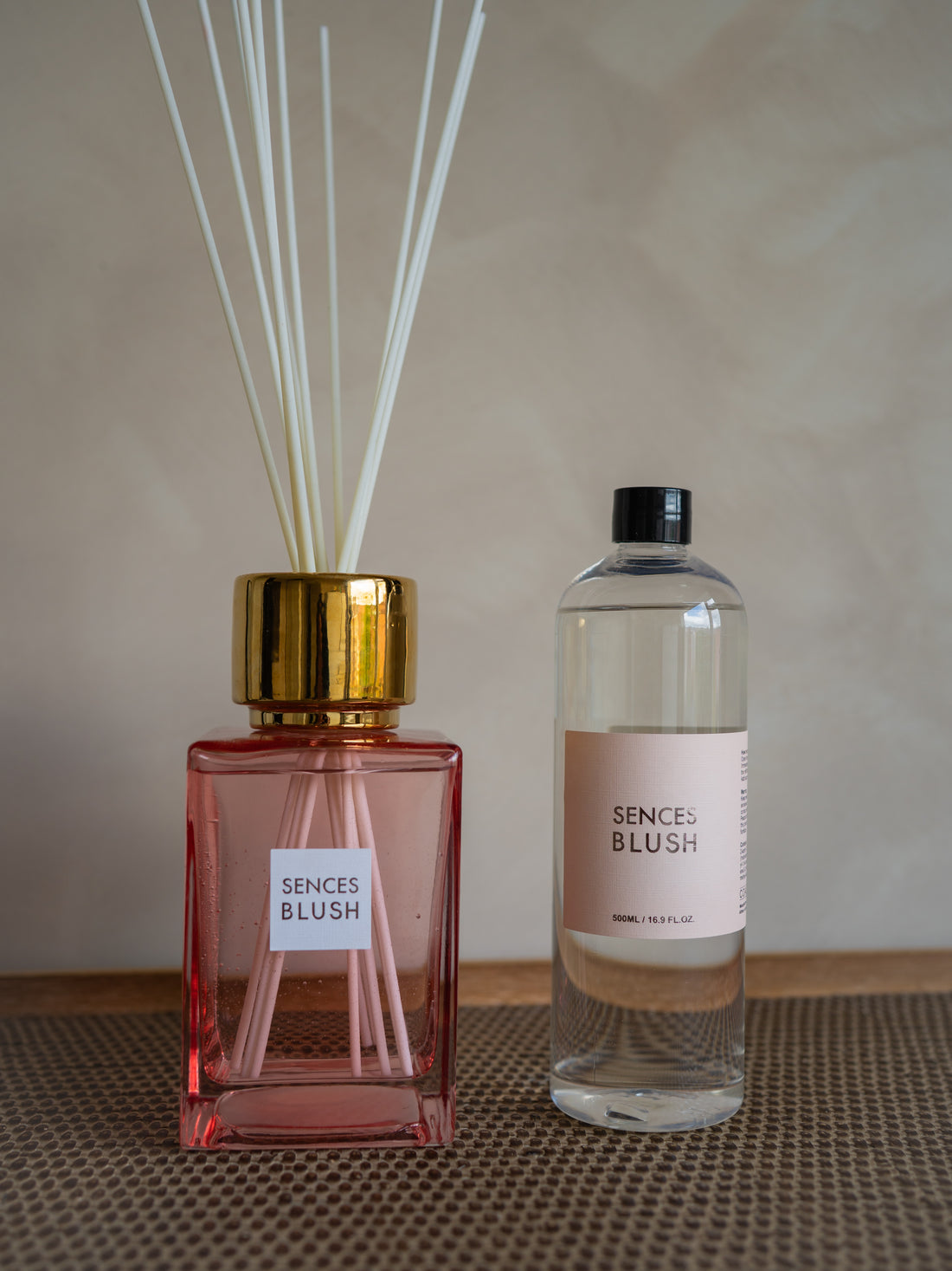 Two diffuser bottles labeled &