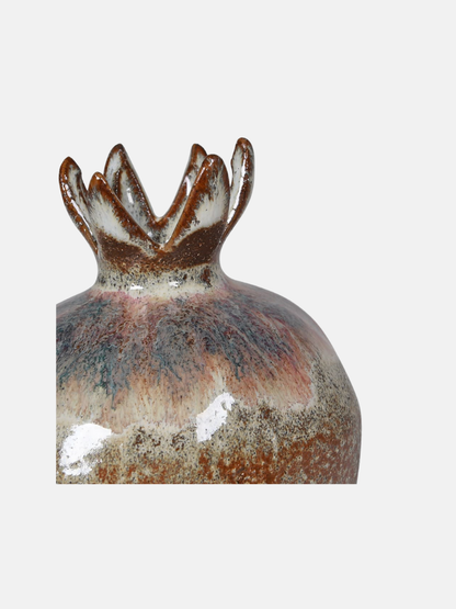 Decorative ceramic vase with unique design on a white background