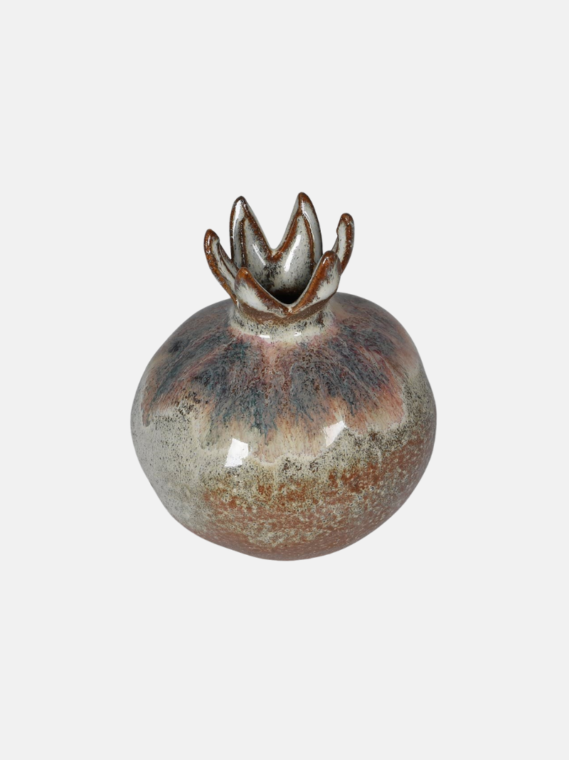 Ceramic vase with a unique design on a white background