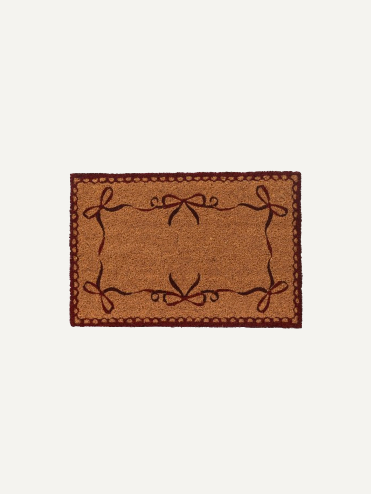 A rectangular coir doormat with a natural brown textured center, a dark reddish-brown decorative border, and dark brown embroidered bow motifs in each corner, shown against a plain off-white background.
