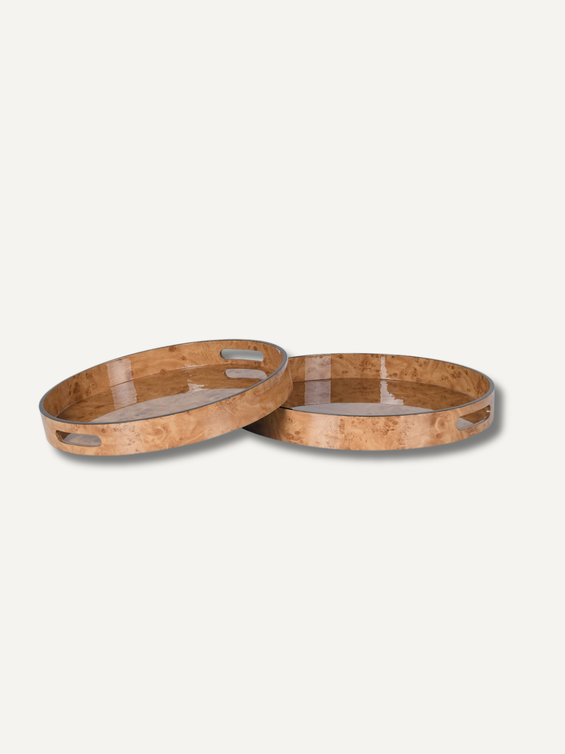 Two wooden burl effect trays on a light gray background for coffee table styling