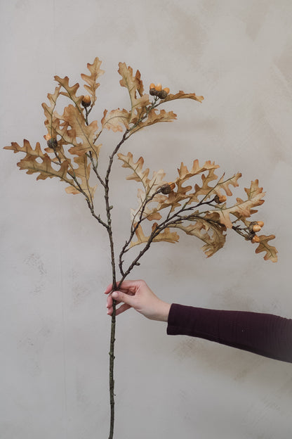 lifelike faux oak leaves and realistic acorns spray