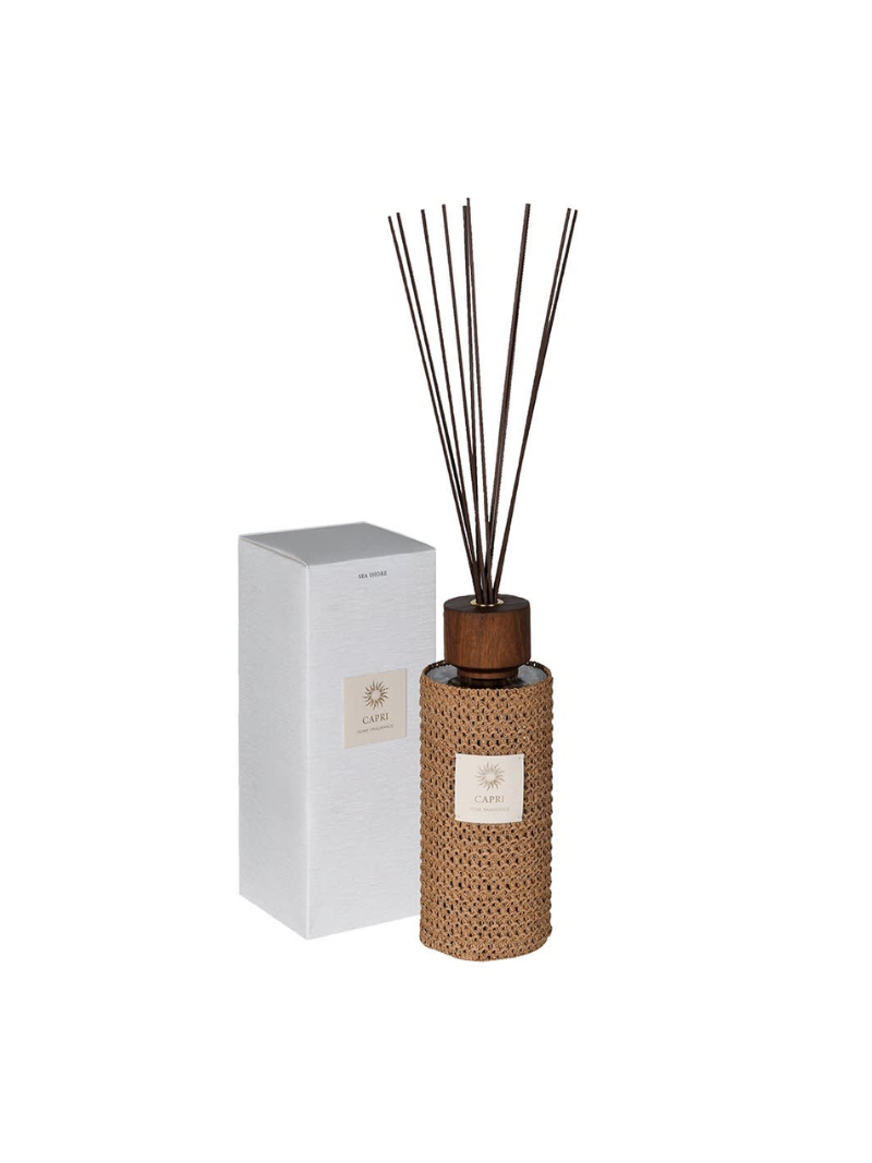 Diffuser bottle with rattan design and wooden cap on a white background