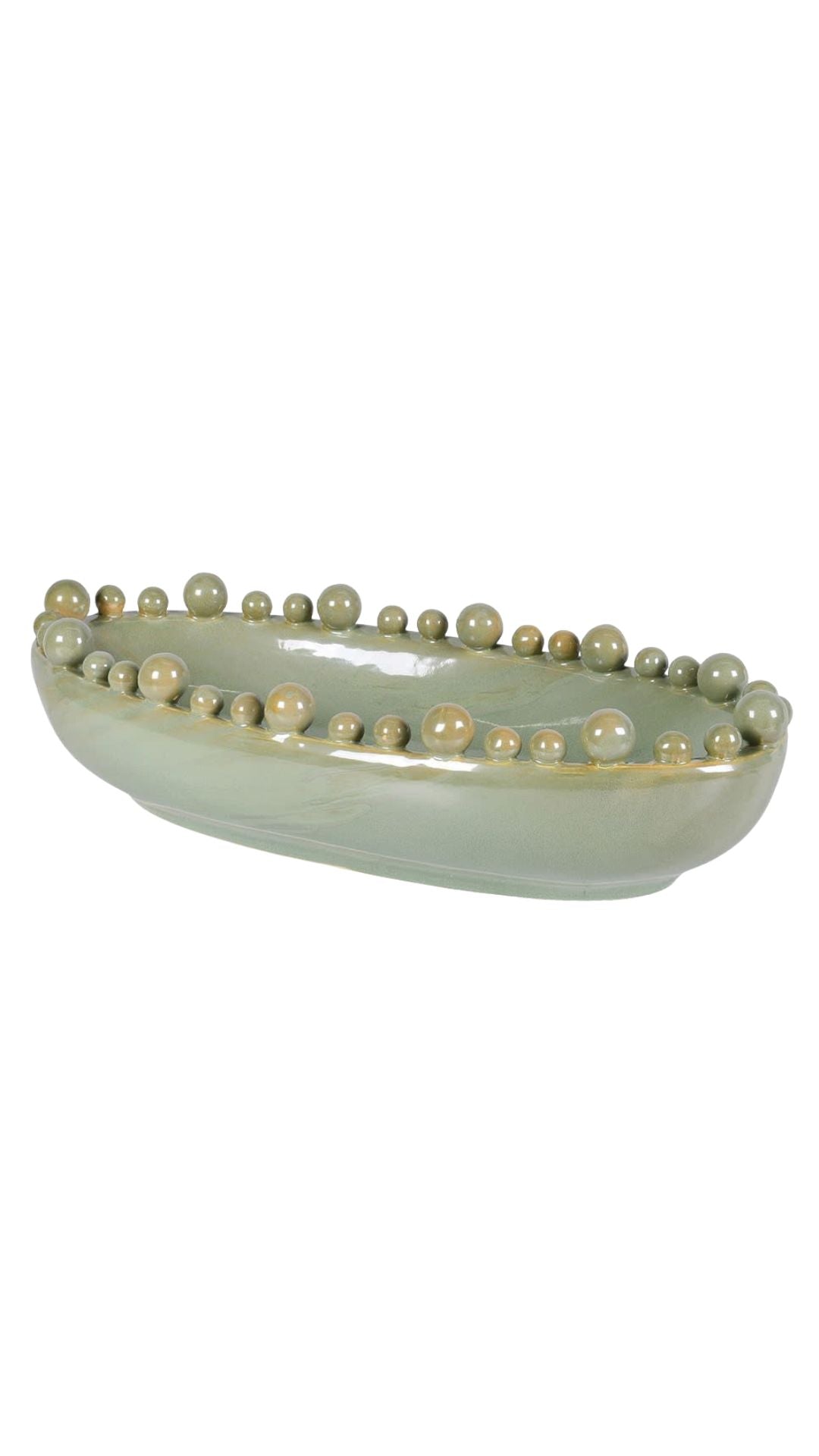 Decorative ceramic bowl with pearl-like bobbles on a white background