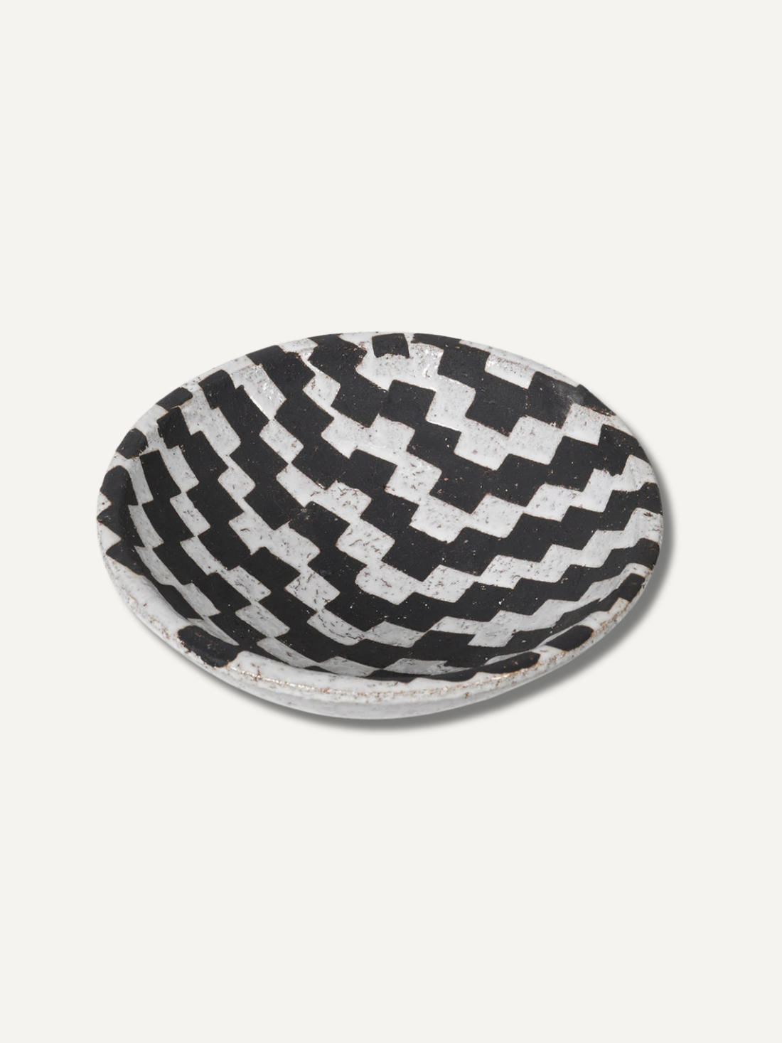 Black and white checkered patterned bowl on a white background