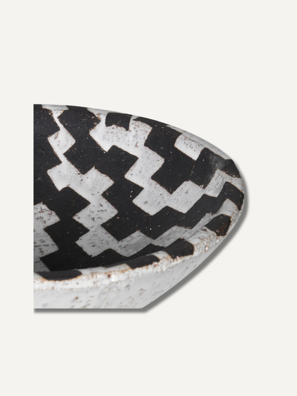 Decorative bowl half-circle with black and white checkered pattern on a light gray background for home decor and styling