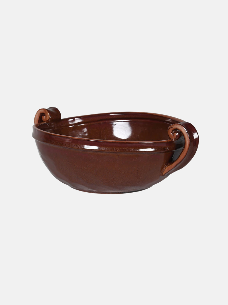 Brown ceramic bowl with handles on a white background