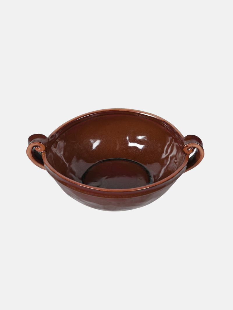 Brown ceramic bowl with handles on a white background