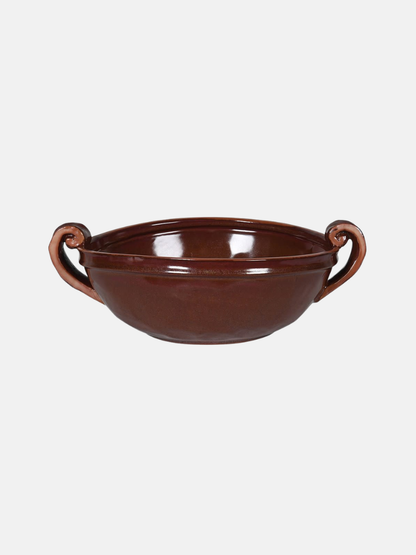Brown ceramic bowl with handles on a white background