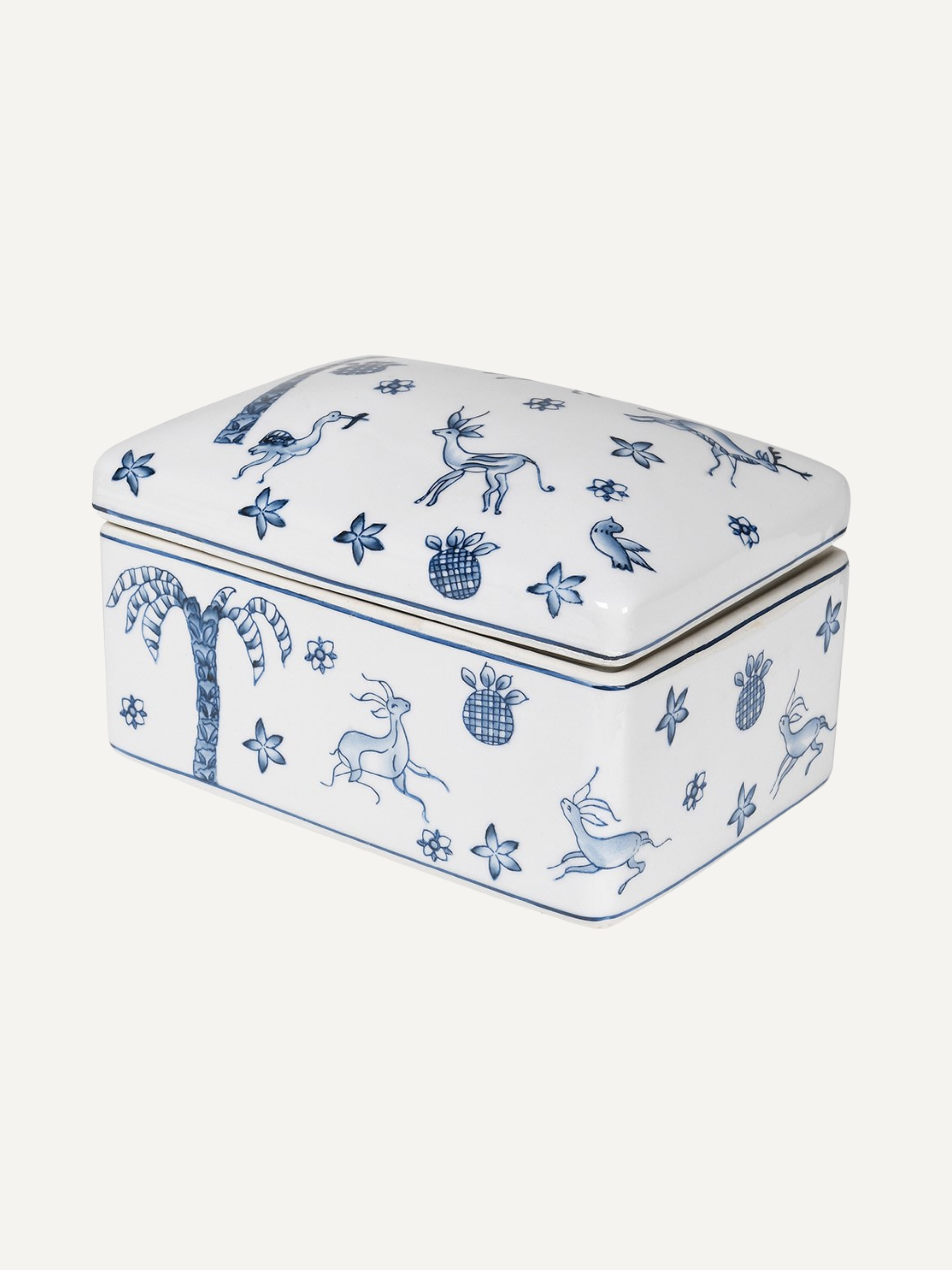 Rectangular ceramic trinket box with blue animal and plant patterns on a white background