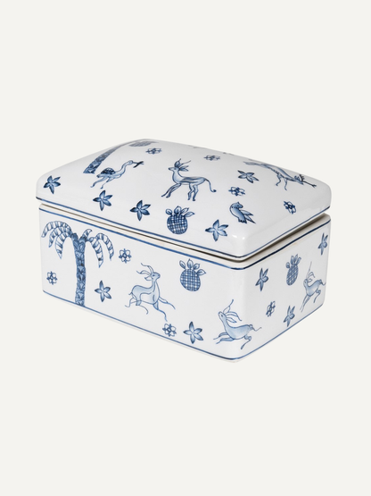 Rectangular ceramic trinket box with blue animal and plant patterns on a white background