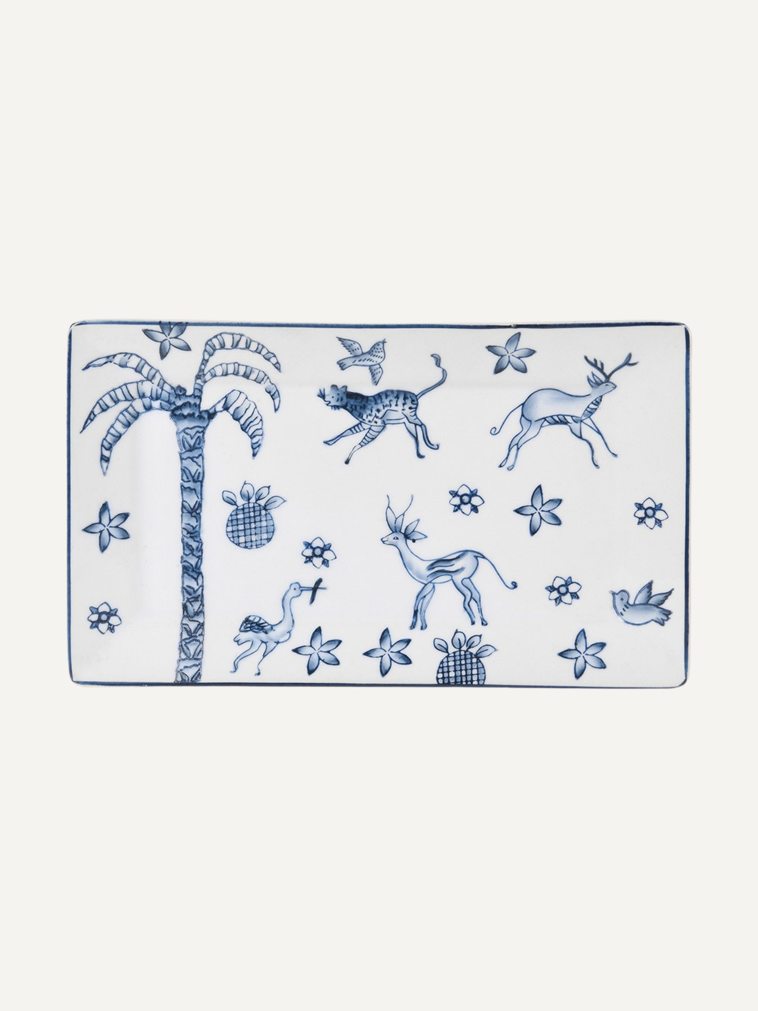 Rectangular white trinket tray with blue animal and plant patterns on a white background