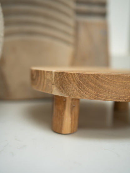 Wooden display stand with a blurred background