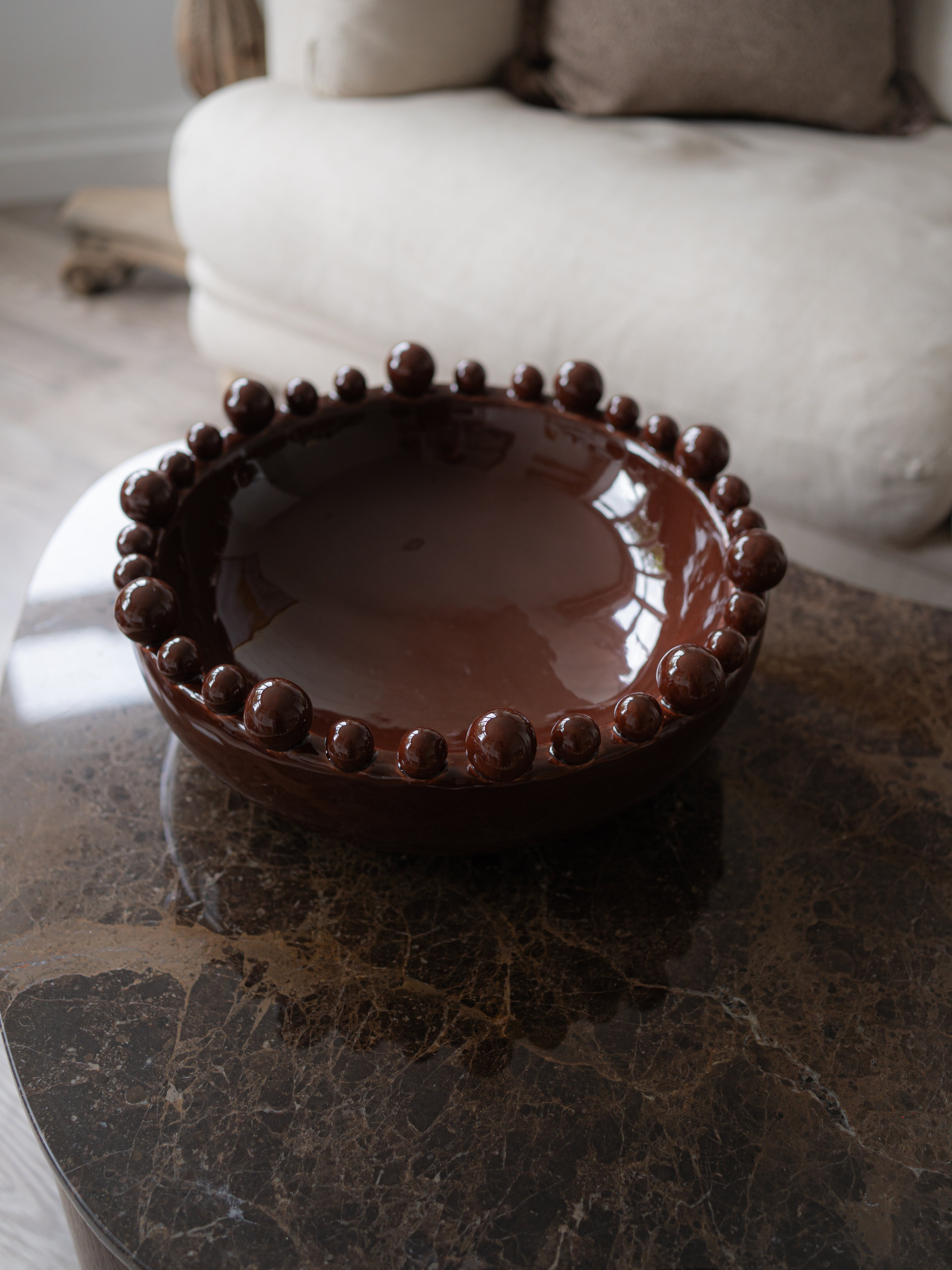 Coco Brown Bobble Edged Bowl on brown marble coffee table