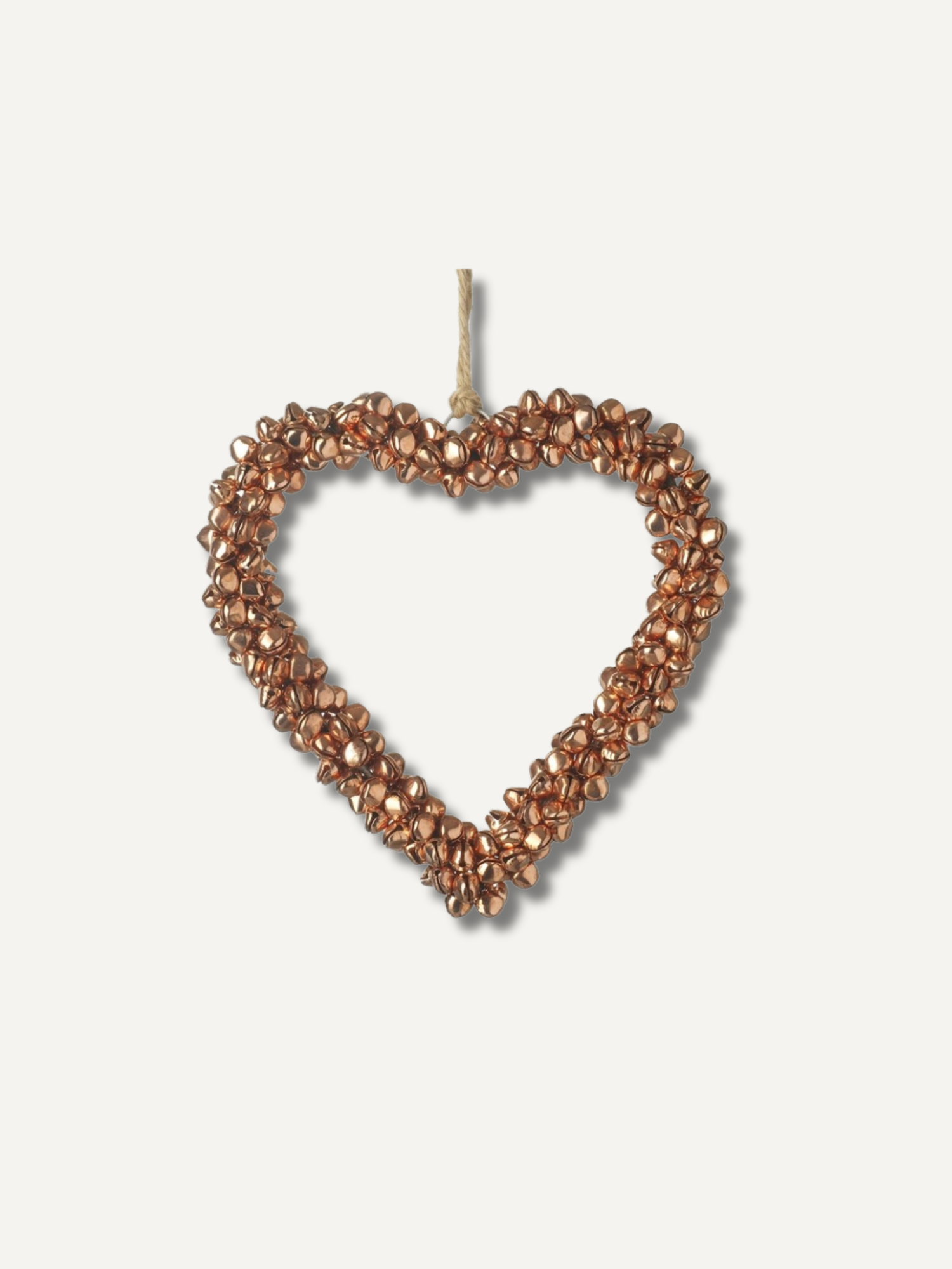 A heart-shaped hanging ornament made of small metallic copper or bronze beads with a natural twine loop at the top, shown against a plain off-white background.