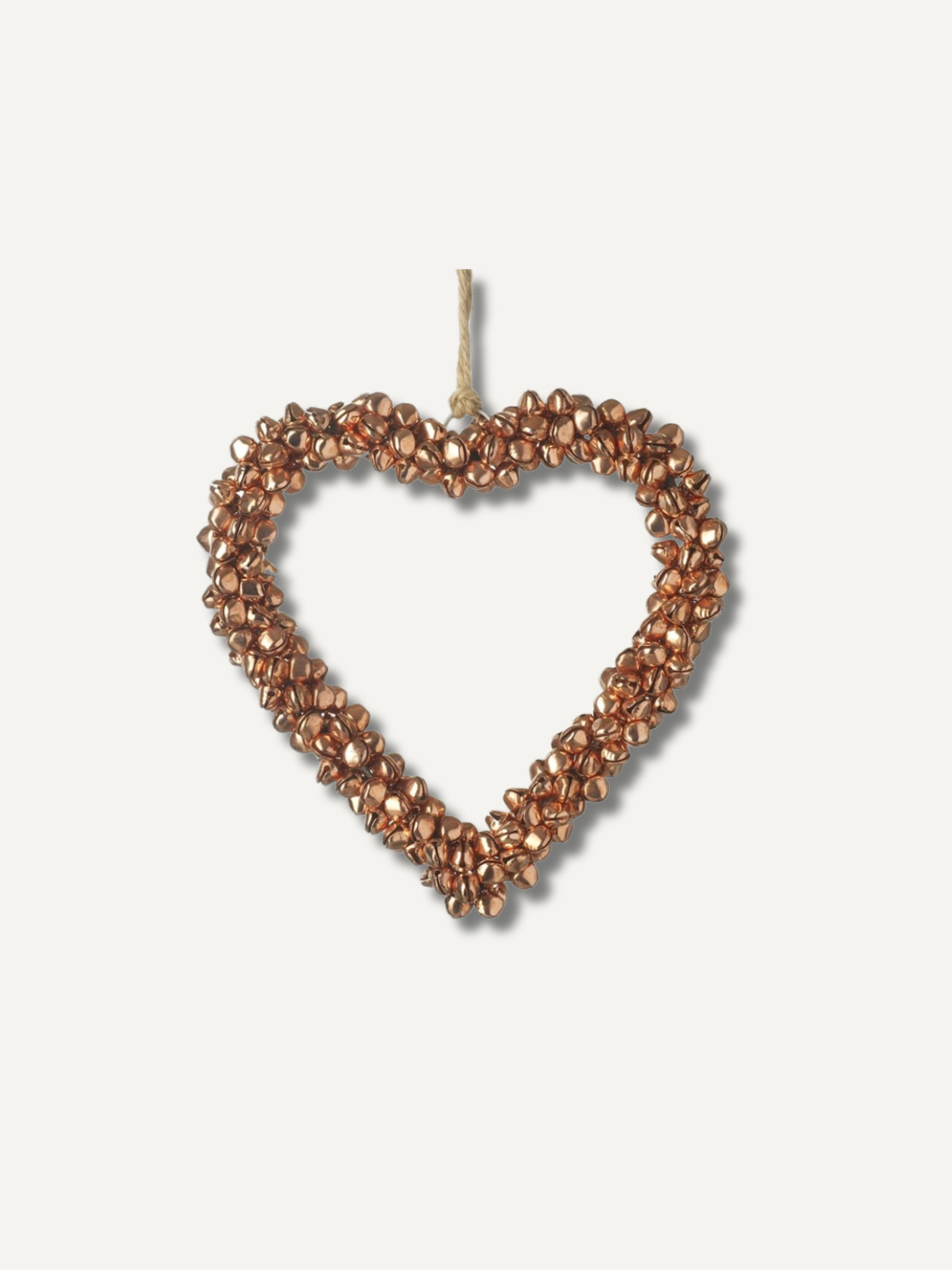 A heart-shaped hanging ornament made of small metallic copper or bronze beads with a natural twine loop at the top, shown against a plain off-white background.