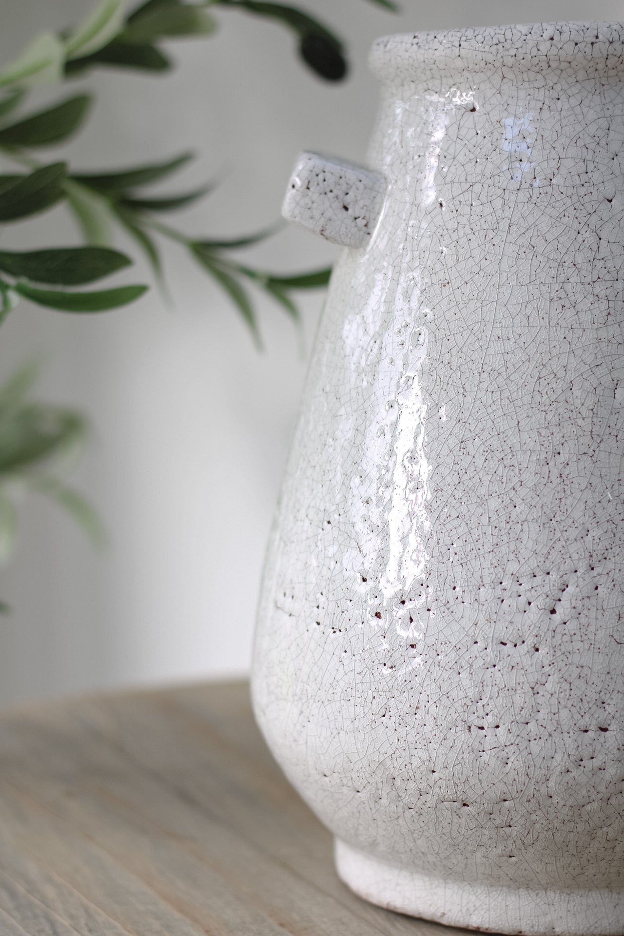 up close of white crackle vase
