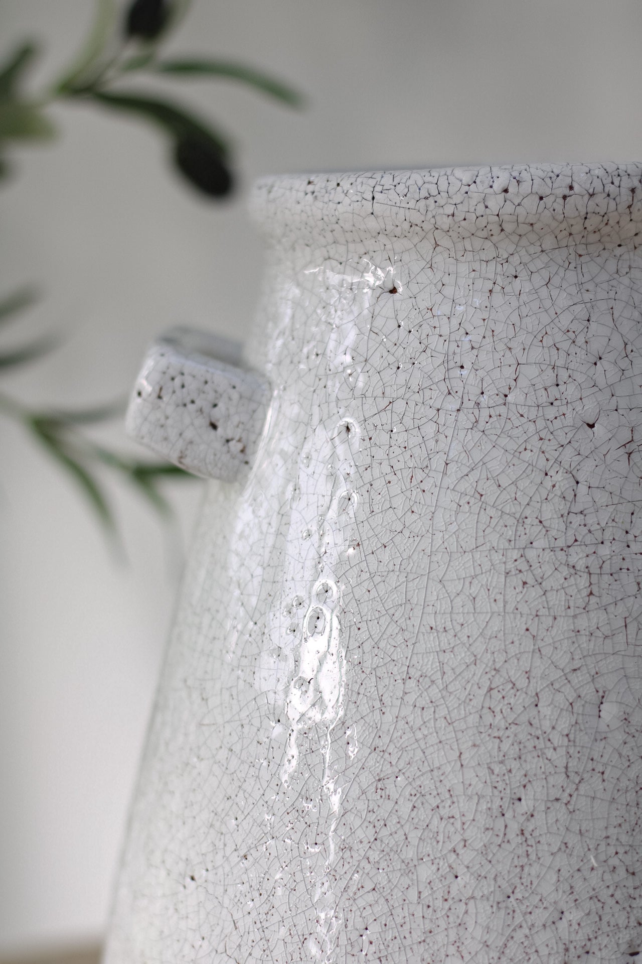 close up of aged decorative white vase