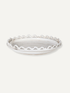 White ceramic wave and bobble bowl with decorative edge on a white background