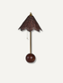A table lamp with a dark brown woven wicker shade, a brass-colored metal stem, and a round dark brown wooden bob weight, shown against a plain off-white background.
