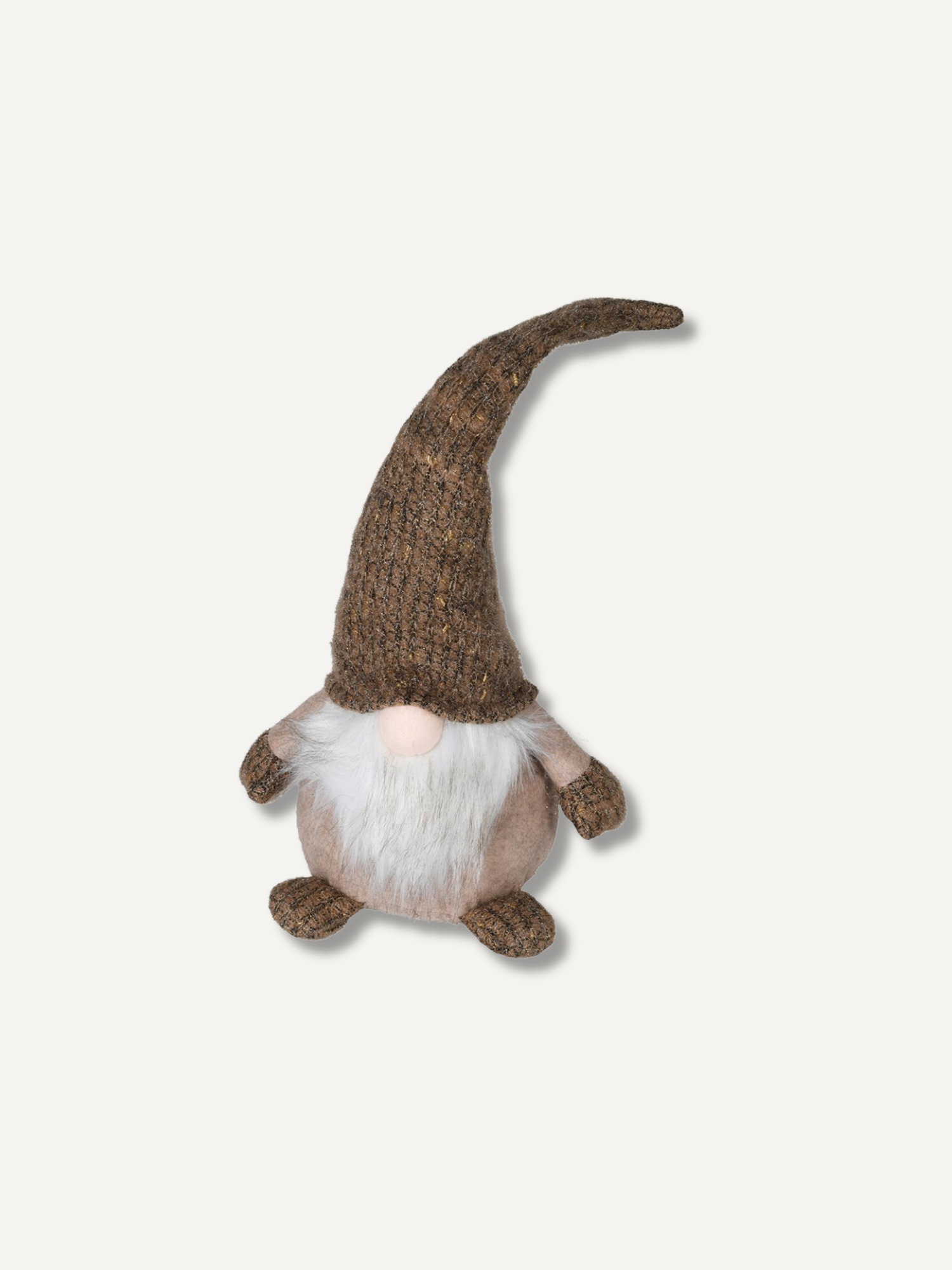 A small knit gnome doll with a long brown pointed hat, white beard, and pale pink face, photographed on a plain light gray background.